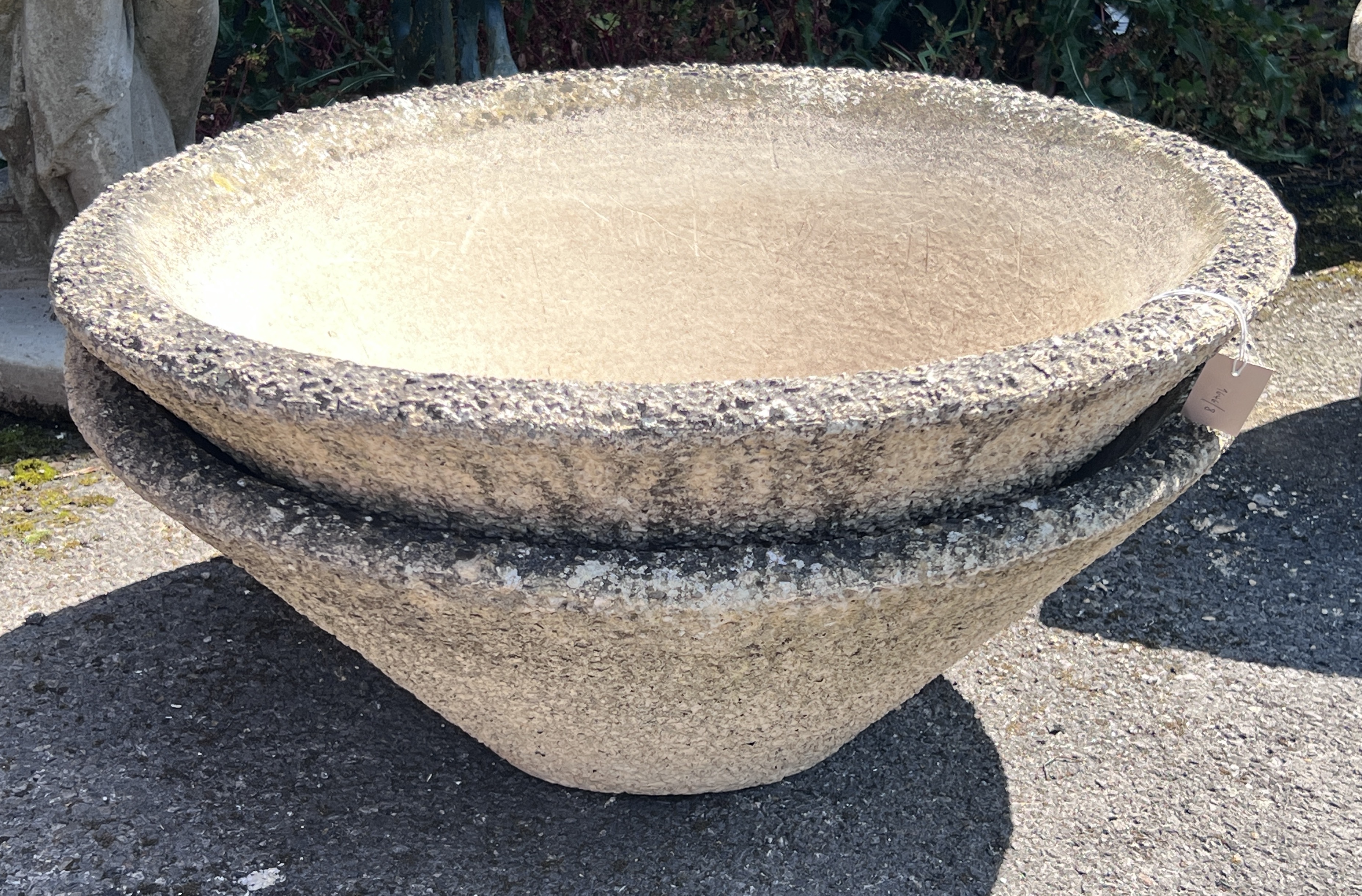A pair of circular reconstituted stone conical planters, diameter 78cm, height 29cm